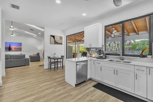 a view of a patio with table and chairs