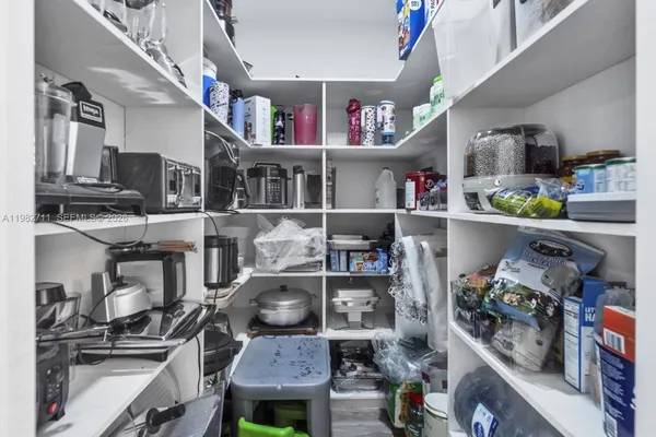 a view of a chairs and table in a room