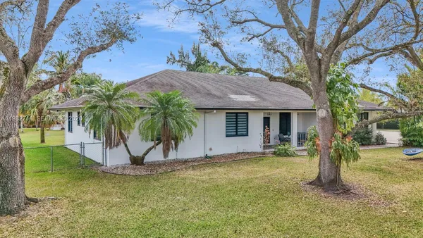 a bird view of a house with a backyard