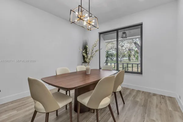 a view of room with furniture and a window