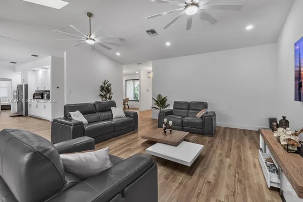 a living room with furniture and a large window