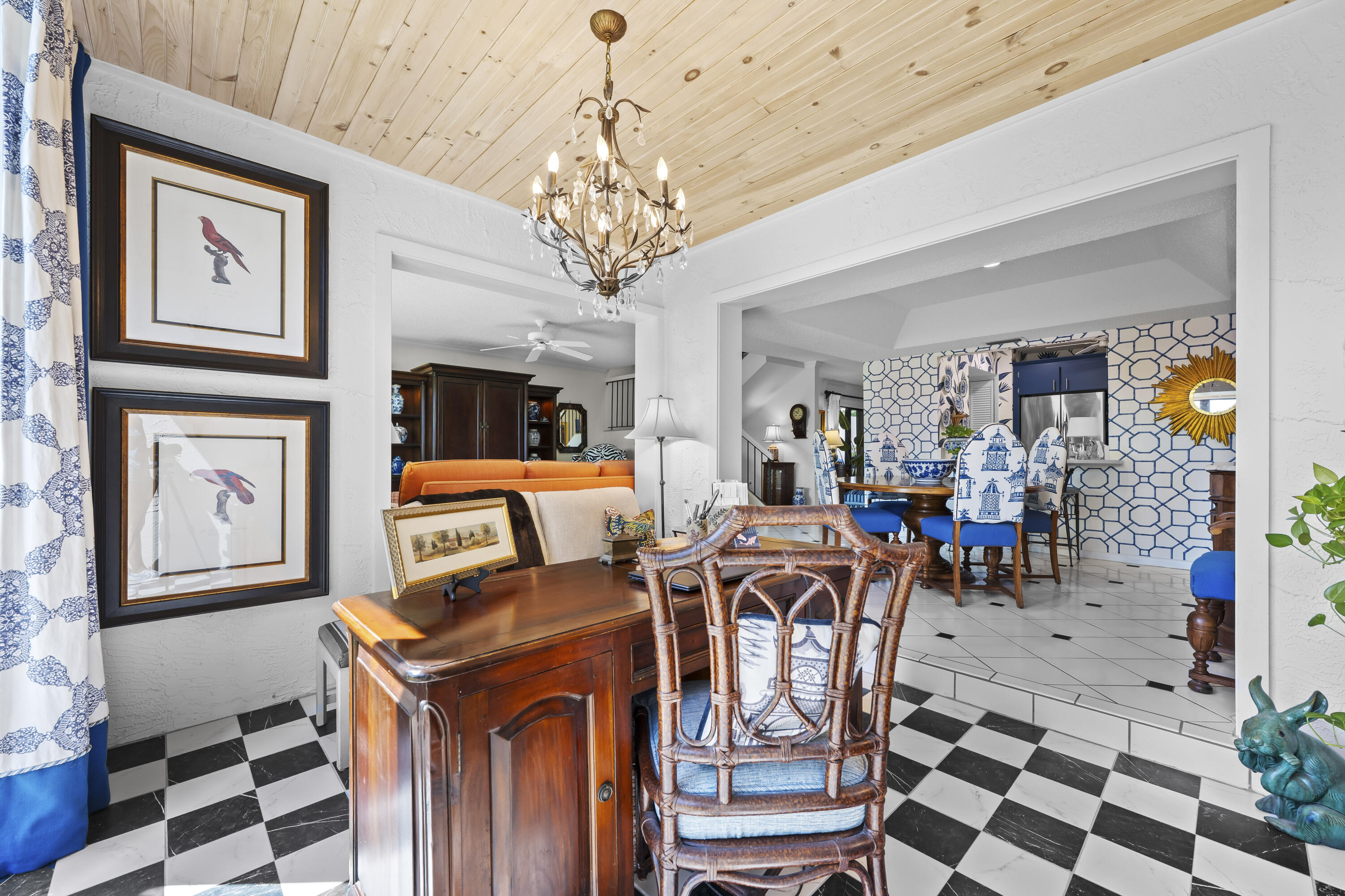 5610 Southeast Foxcross Place Stuart, FL 34997 - Photo 14 of 39 a view of a dining room with furniture a chandelier and wooden floor