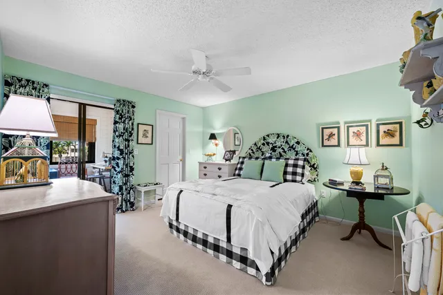 a bedroom with a bed and a table in it