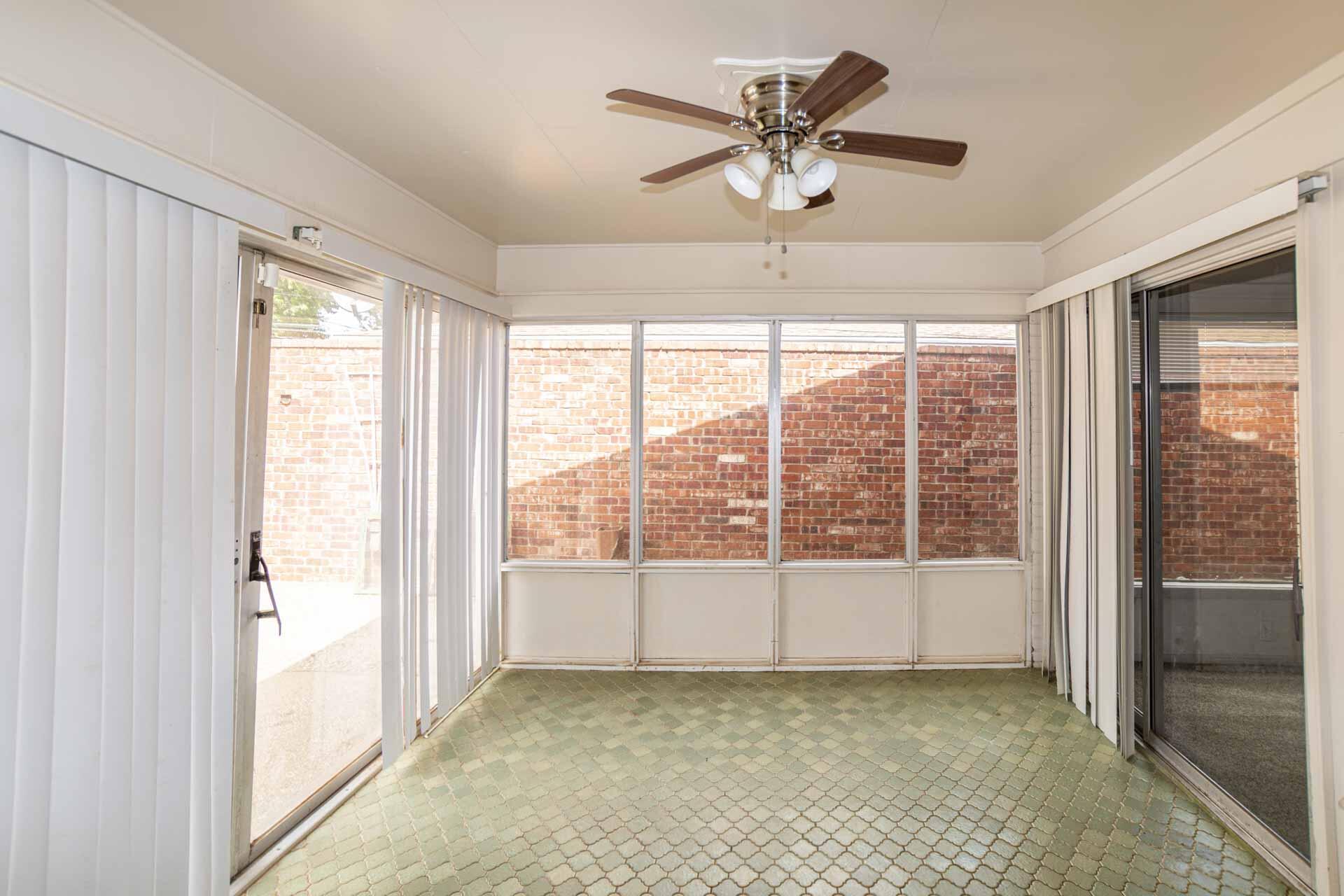 2136 57th Street Lubbock, TX 79412 - Photo 20 of 41 a view of a big room with wooden floor and windows