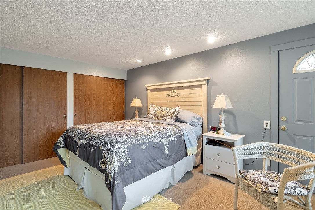 2603 177th Street Southeast Bothell, WA 98012 - Photo 13 of 25 a bedroom with a bed and wooden floor