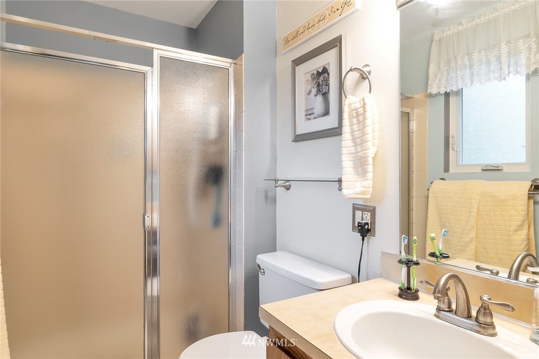 2603 177th Street Southeast Bothell, WA 98012 - Photo 14 of 25 a bathroom with a sink toilet and shower