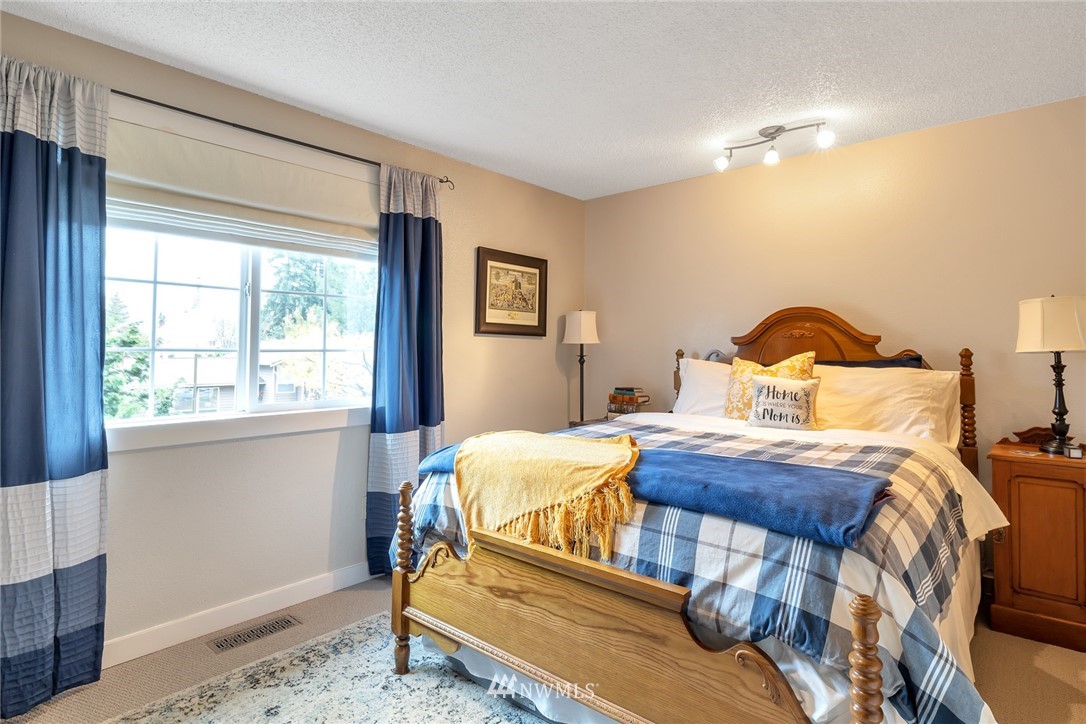 2603 177th Street Southeast Bothell, WA 98012 - Photo 17 of 25 a bedroom with a bed and window