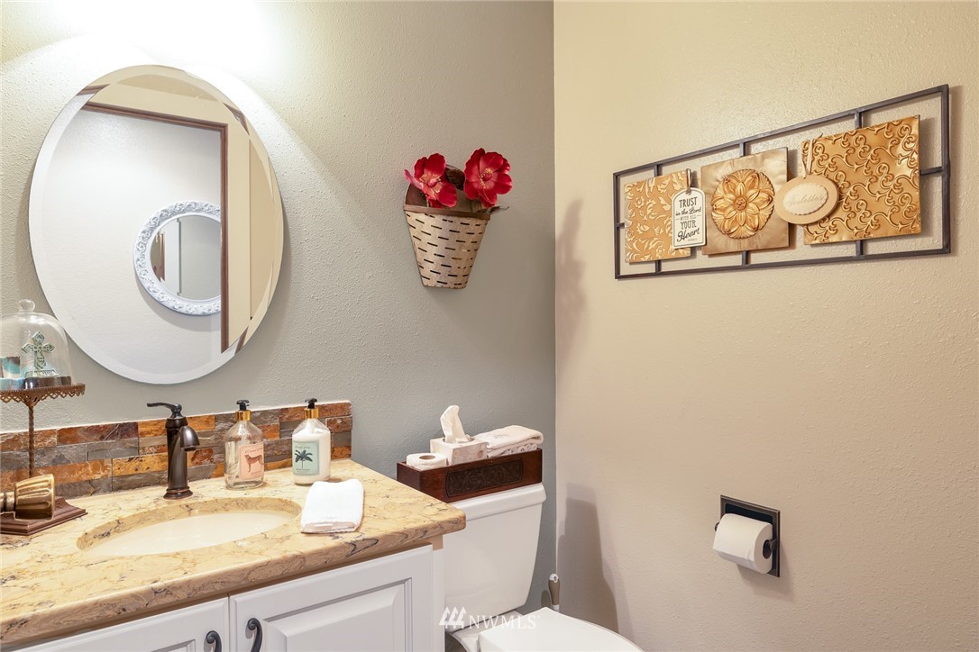 2603 177th Street Southeast Bothell, WA 98012 - Photo 19 of 25 a bathroom with a sink and a mirror
