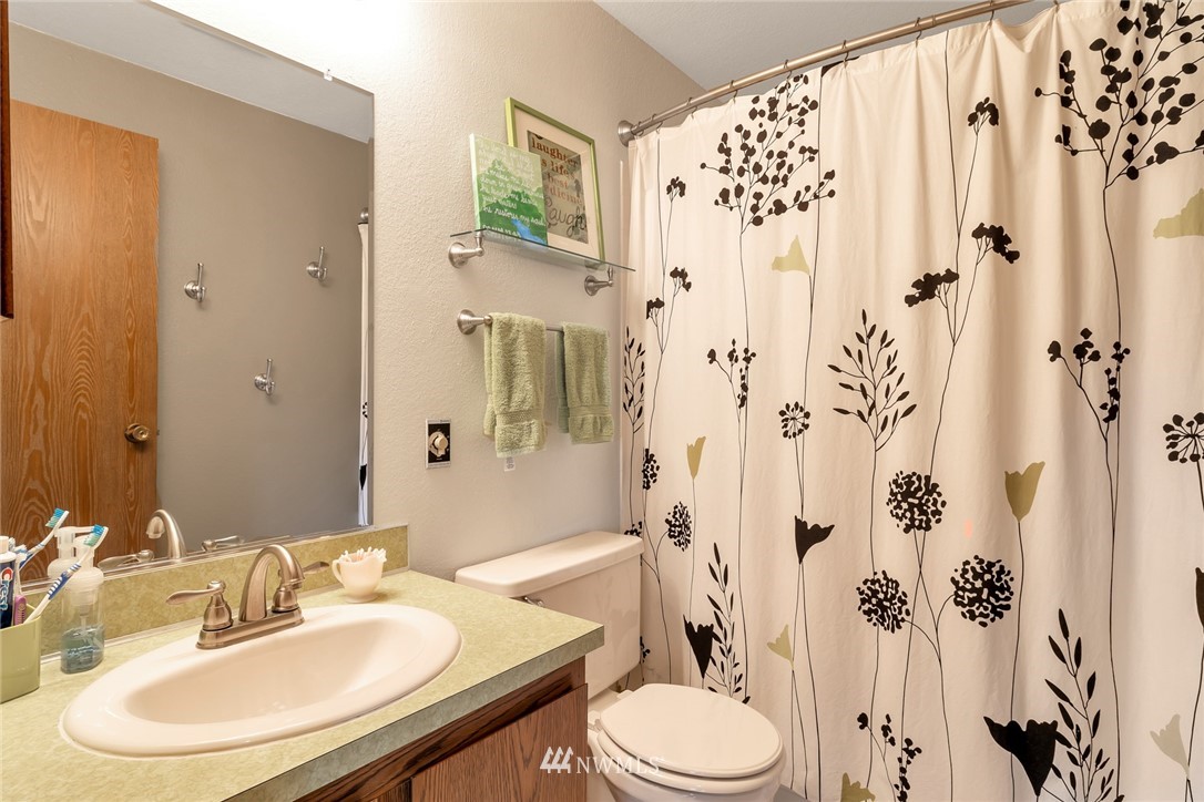2603 177th Street Southeast Bothell, WA 98012 - Photo 20 of 25 a bathroom with a sink toilet and shower