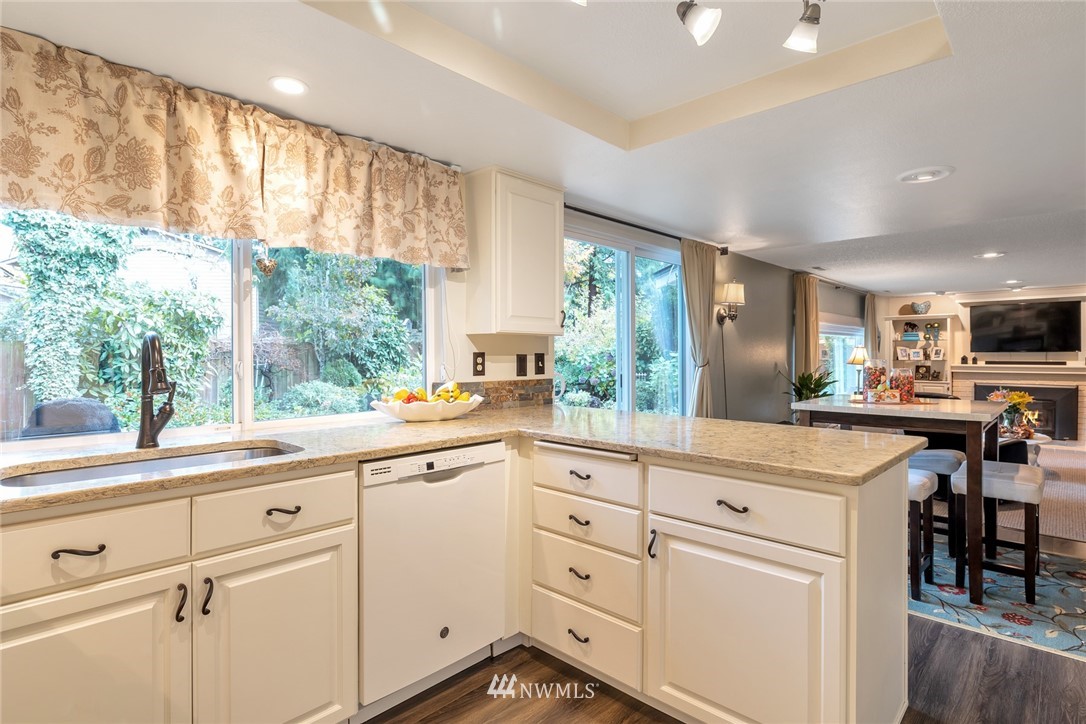 2603 177th Street Southeast Bothell, WA 98012 - Photo 3 of 25 a kitchen with white cabinets and white appliances