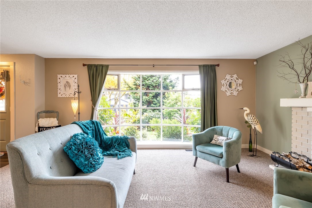 2603 177th Street Southeast Bothell, WA 98012 - Photo 6 of 25 a living room with furniture and a large window