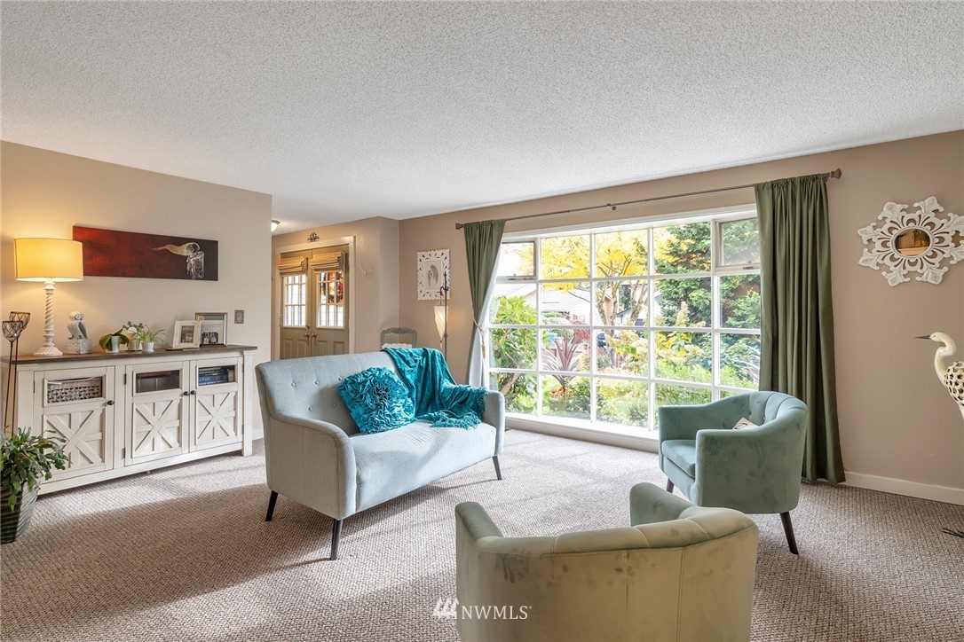 2603 177th Street Southeast Bothell, WA 98012 - Photo 7 of 25 a living room with furniture and a large window