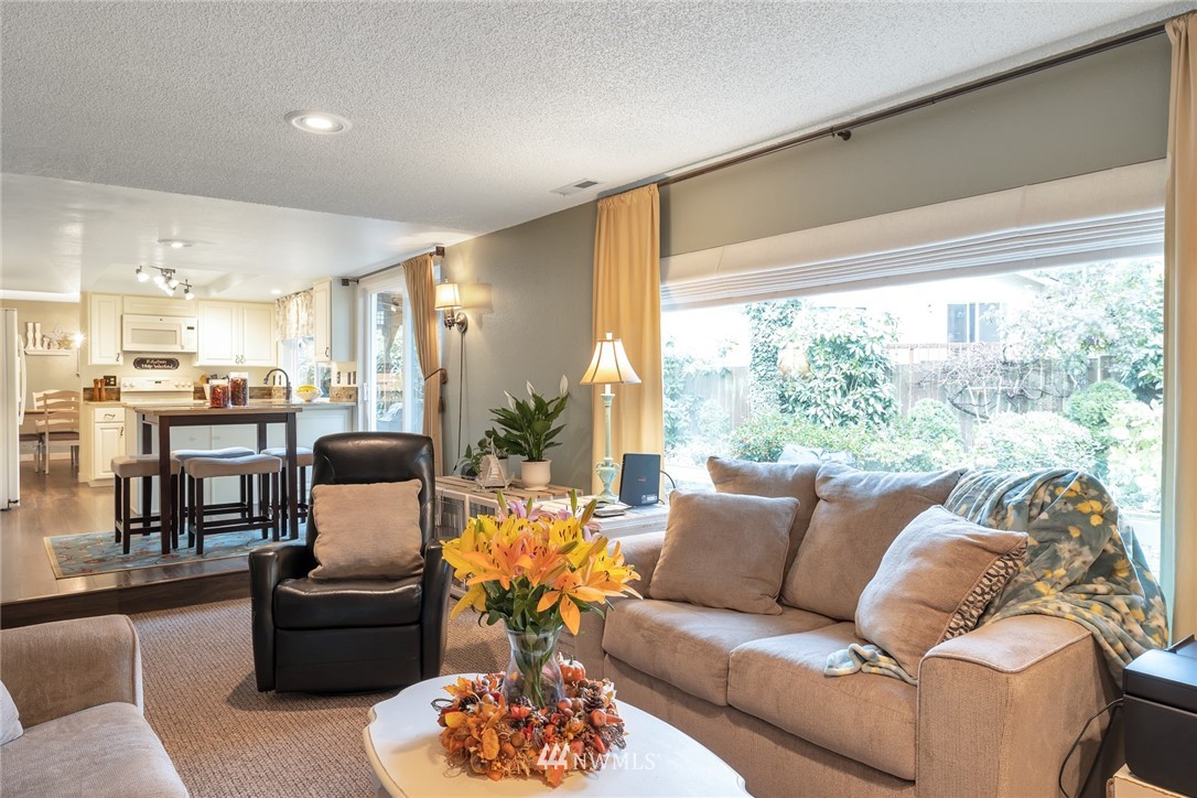 2603 177th Street Southeast Bothell, WA 98012 - Photo 10 of 25 a living room with furniture and a large window