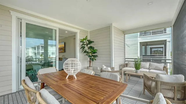 a living room with furniture a table and a potted plant