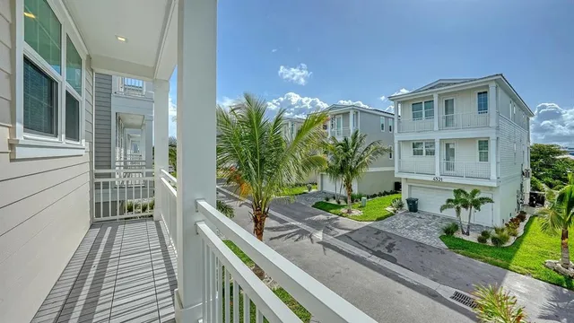 a view of a balcony with potted plants