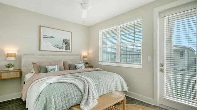 a bedroom with a bed and a painting on the wall