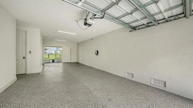 a view of a big room with closet and windows