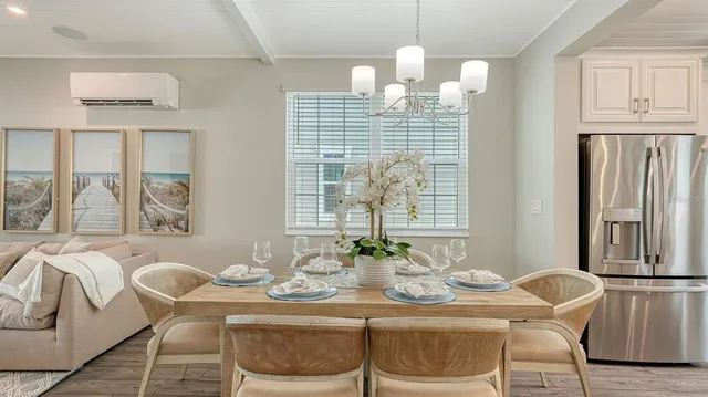 a dining room with furniture and window