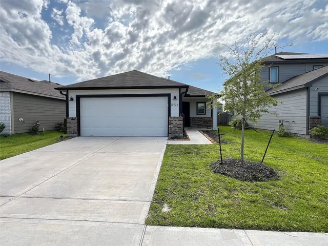 a house view with a backyard space