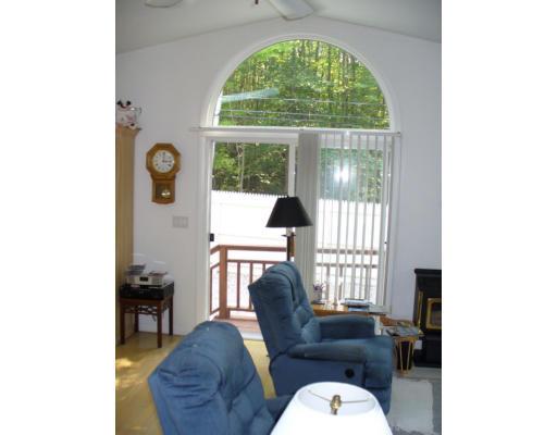 72 South Shore Road Westhampton, MA 01027 - Photo 6 of 10 a living room with furniture and a large window