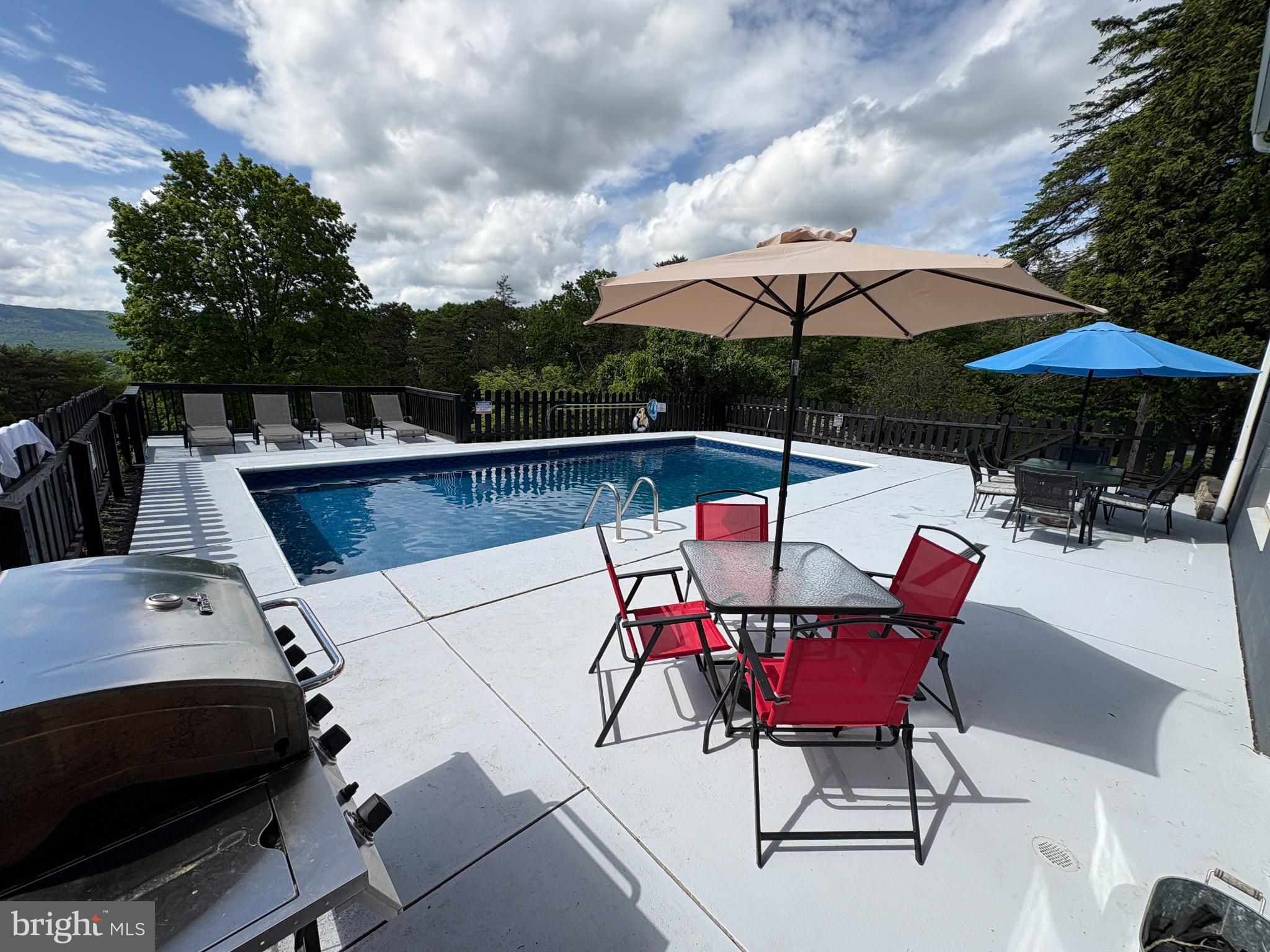 13644 Upper Corners Road Hesston, PA 16647 - Photo 22 of 28 Sunny poolside retreat with scenic views.