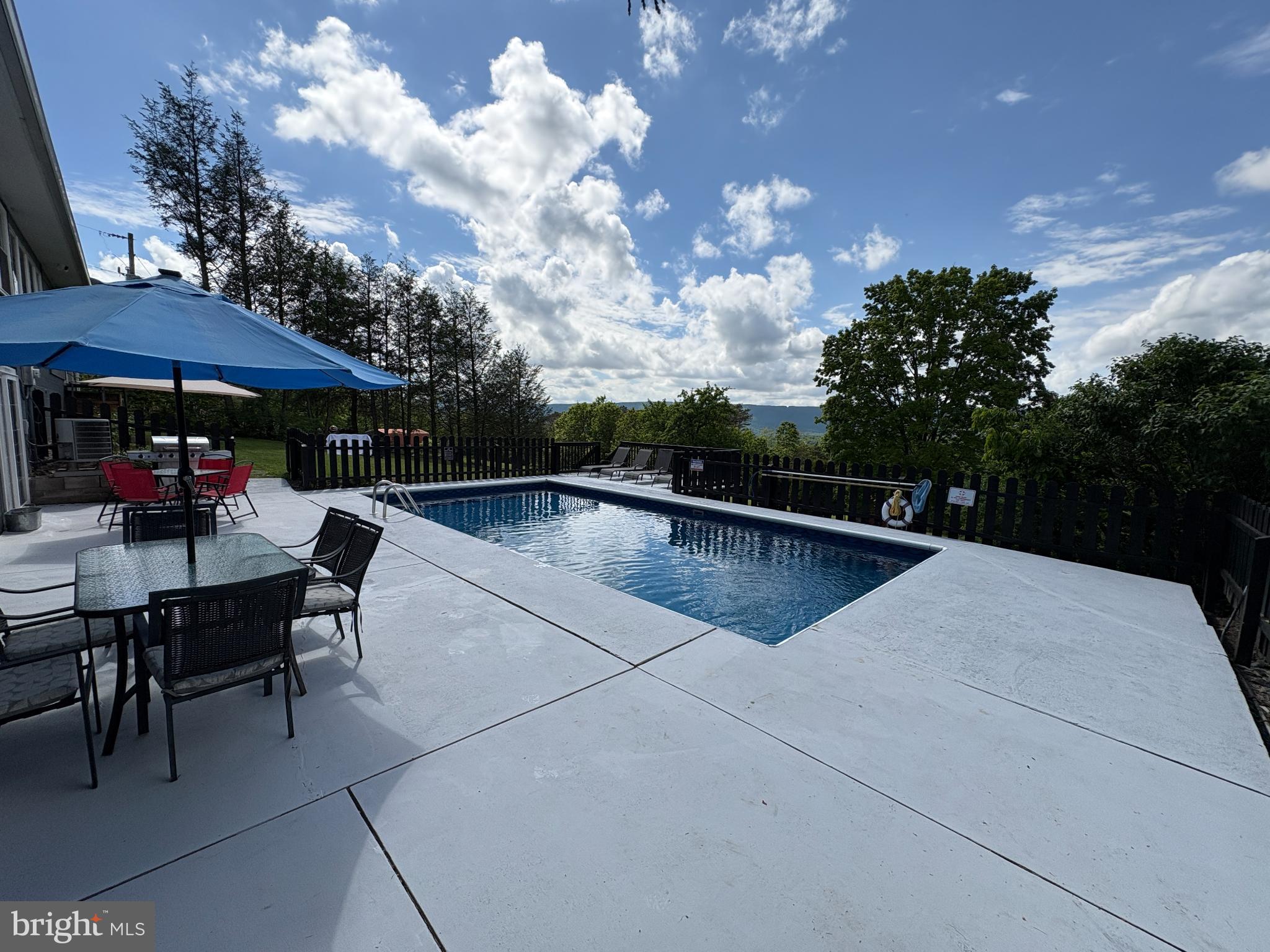 13644 Upper Corners Road Hesston, PA 16647 - Photo 24 of 28 Serene poolside retreat with scenic views.