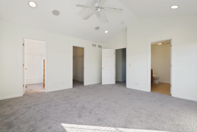 770 Lambert Lane, Unit 966 Bartlett, IL 60103 - Photo 18 of 33 an empty room with closet and a ceiling fan