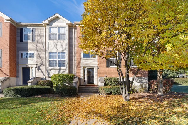 770 Lambert Lane, Unit 966 Bartlett, IL 60103 - Photo 2 of 33 a front view of a house with garden