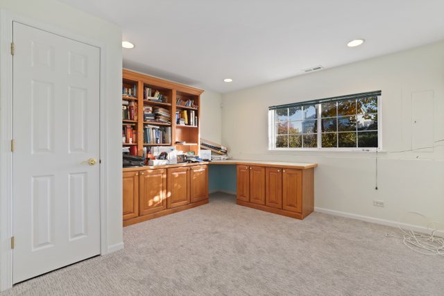 770 Lambert Lane, Unit 966 Bartlett, IL 60103 - Photo 26 of 33 a kitchen with a refrigerator and cabinets