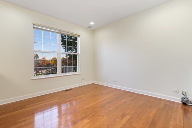 770 Lambert Lane, Unit 966 Bartlett, IL 60103 - Photo 9 of 33 a view of an empty room with a window