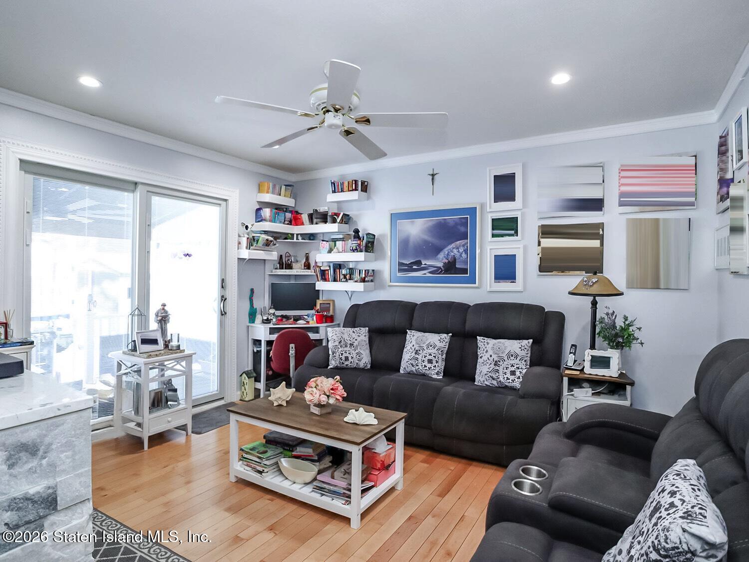 69 Stecher Street Staten Island, NY 10312 - Photo 11 of 45 a living room with furniture and a large window