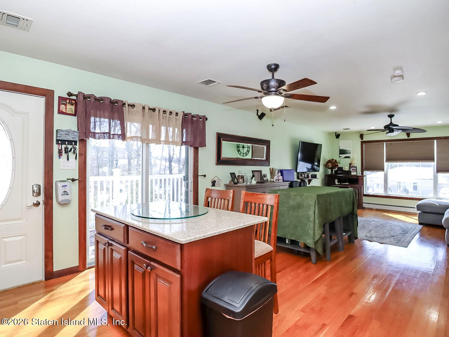 69 Stecher Street Staten Island, NY 10312 - Photo 26 of 45 a living room with furniture and a large window