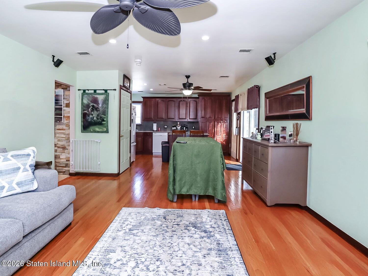 69 Stecher Street Staten Island, NY 10312 - Photo 28 of 45 a living room with furniture and wooden floor
