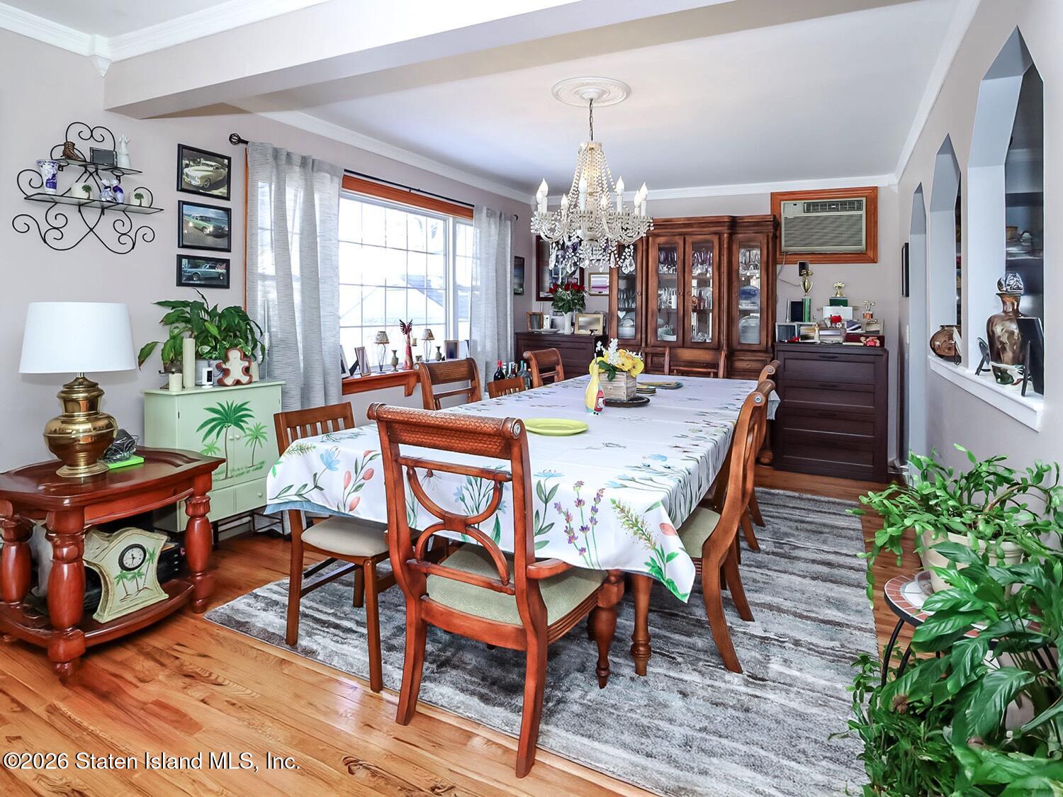 69 Stecher Street Staten Island, NY 10312 - Photo 5 of 45 a view of a dining room with furniture window and wooden floor