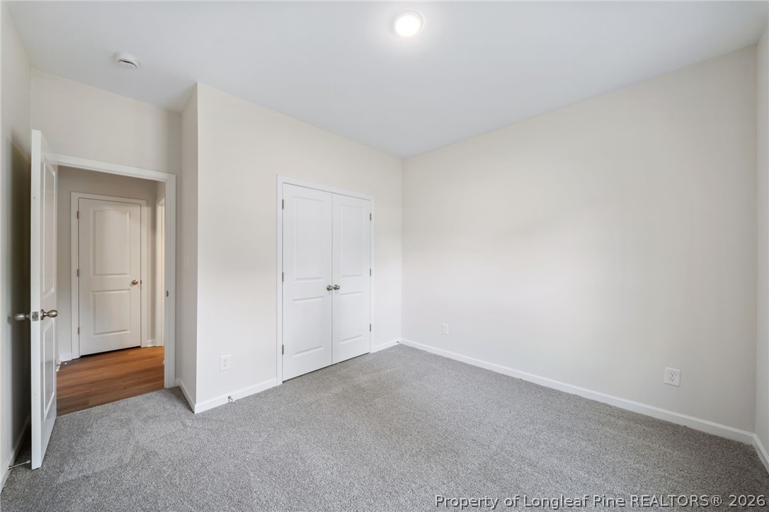 4044 Lofton Street Wade, NC 28395 - Photo 18 of 33 a view of an empty room and closet area