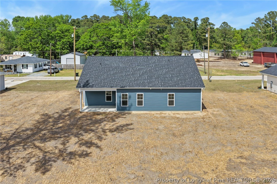 4044 Lofton Street Wade, NC 28395 - Photo 24 of 33 a aerial view of a house with swimming pool and large trees