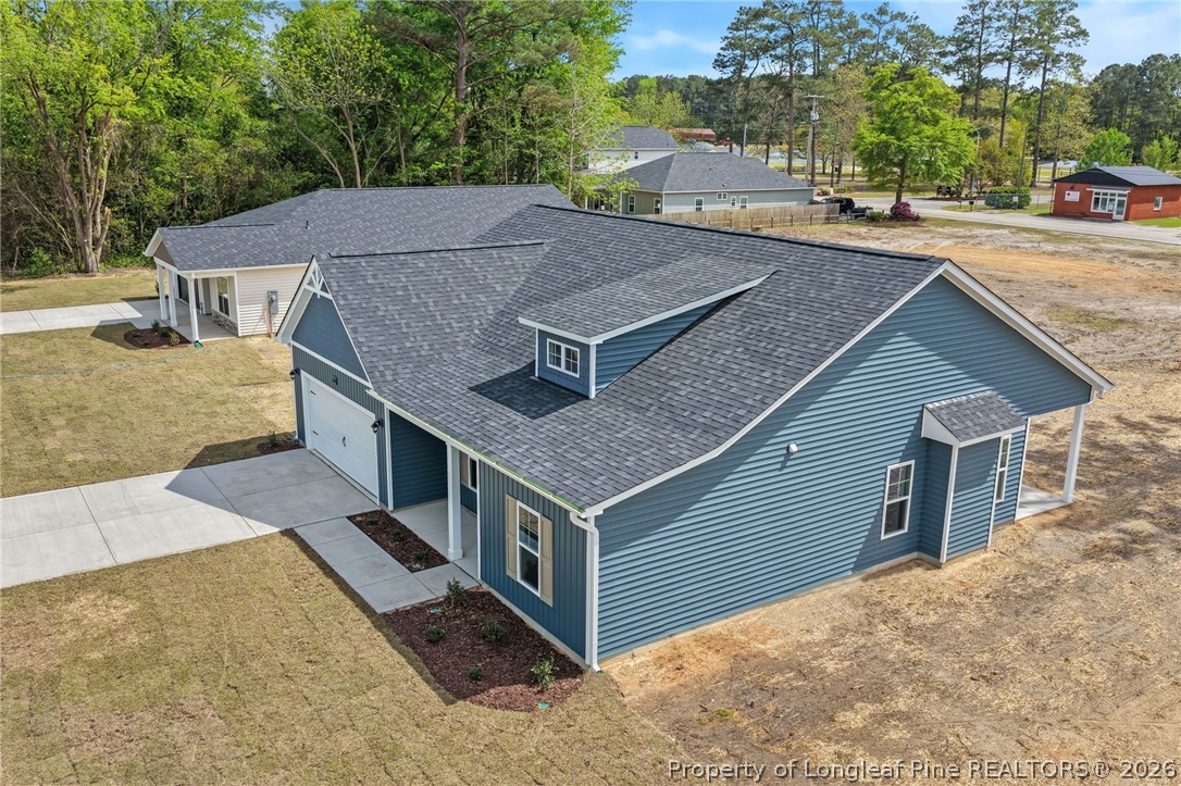 4044 Lofton Street Wade, NC 28395 - Photo 26 of 33 a aerial view of a house with a yard
