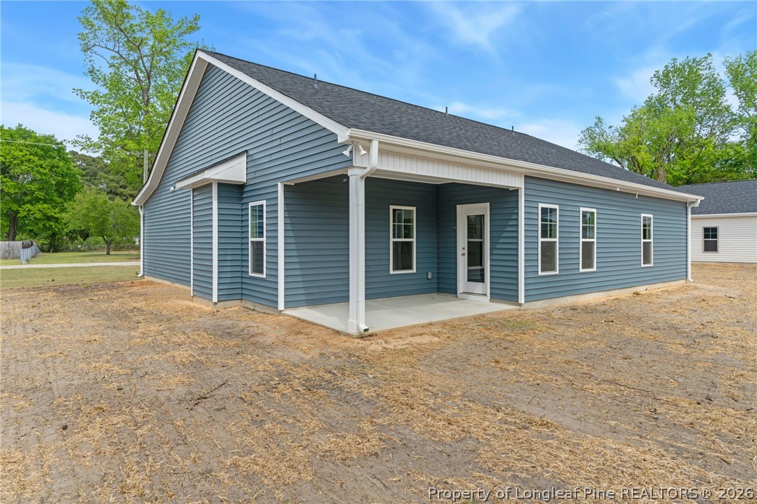 4044 Lofton Street Wade, NC 28395 - Photo 28 of 33 a view of a house with a yard and garage
