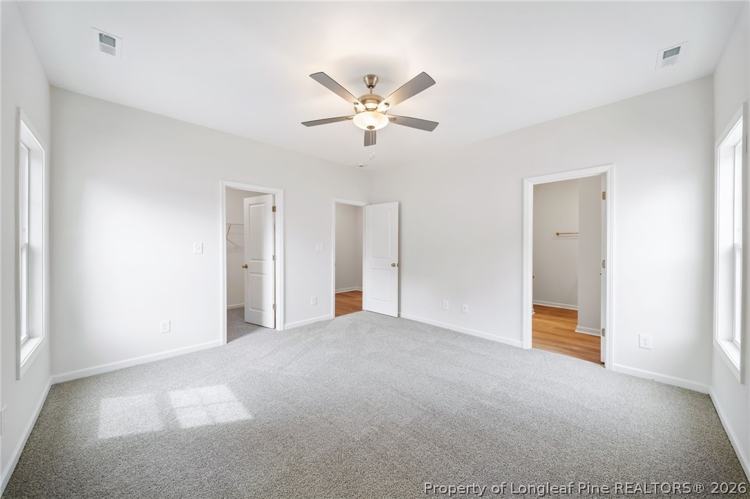 4044 Lofton Street Wade, NC 28395 - Photo 10 of 33 a view of an empty room with a ceiling fan
