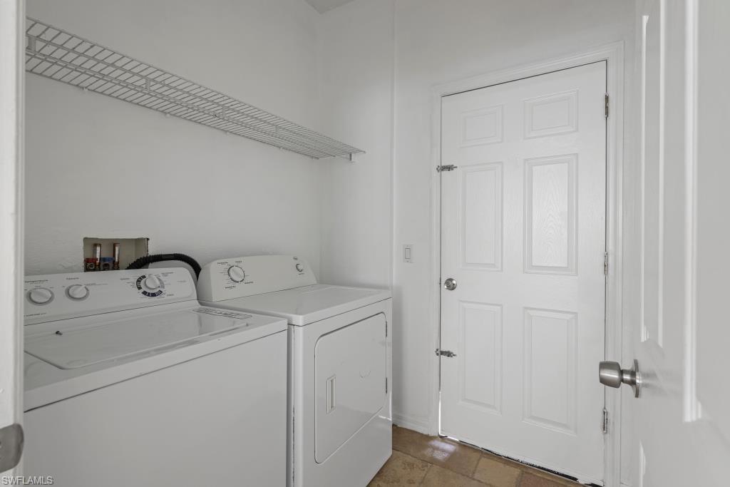Undisclosed Address Naples, FL 34120 - Photo 10 of 24 Laundry area featuring washing machine and dryer