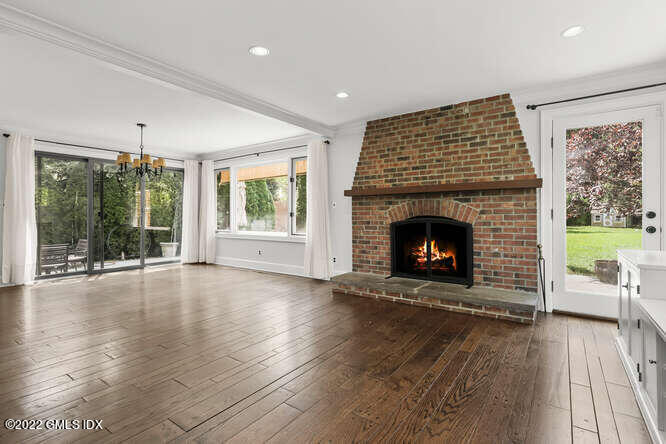 14 Terrace Avenue Riverside, CT 06878 - Photo 12 of 28 a view of an empty room with wooden floor fireplace and a window