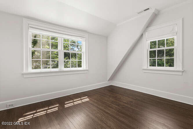 14 Terrace Avenue Riverside, CT 06878 - Photo 19 of 28 a view of an empty room with wooden floor and windows