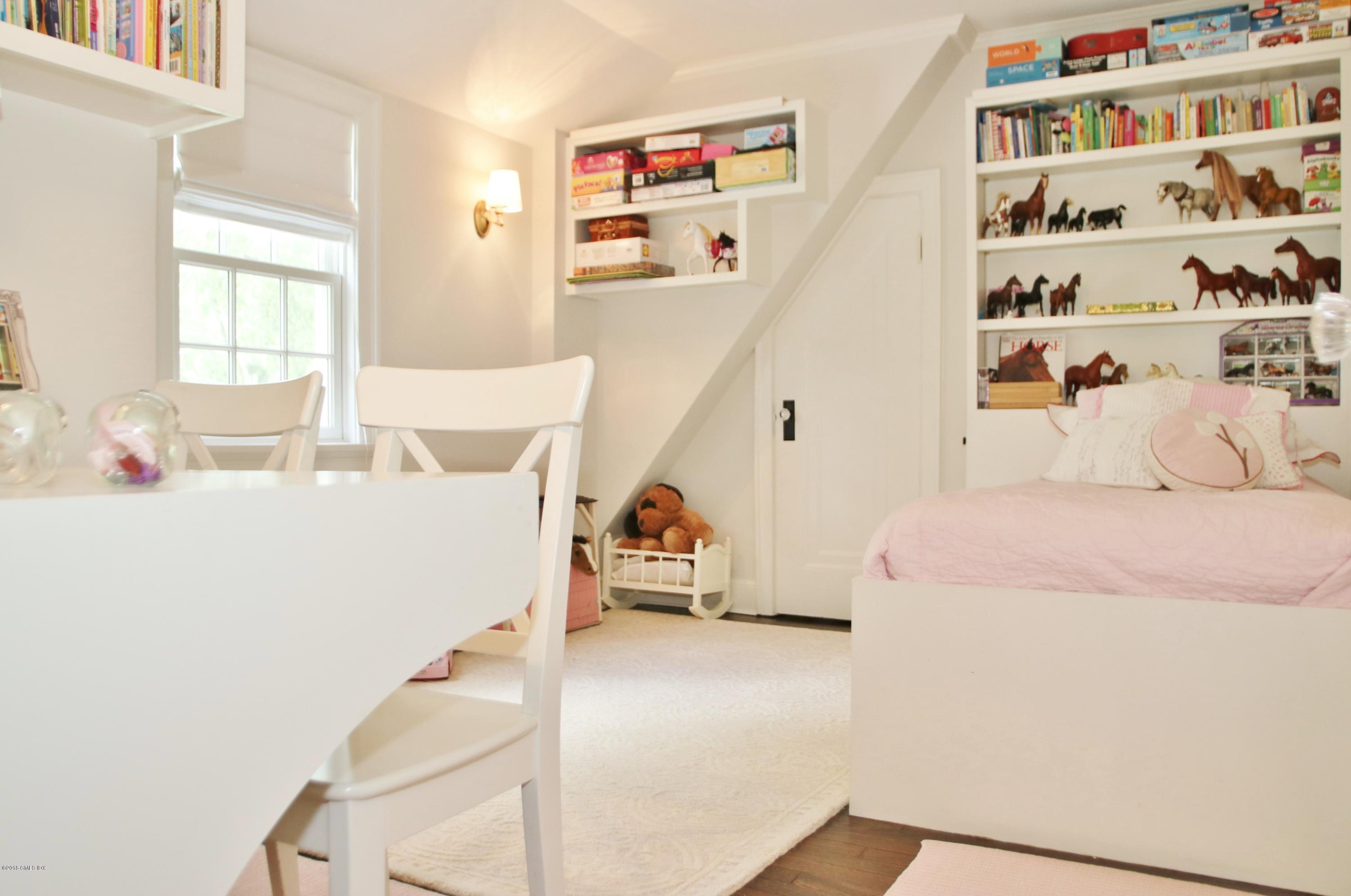 14 Terrace Avenue Riverside, CT 06878 - Photo 22 of 28 a bedroom with a bed and a white cabinet