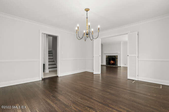 14 Terrace Avenue Riverside, CT 06878 - Photo 6 of 28 an empty room with wooden floor fireplace and windows