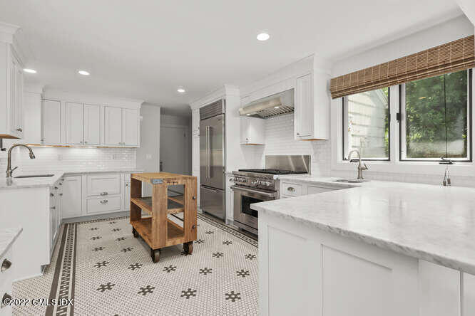 14 Terrace Avenue Riverside, CT 06878 - Photo 9 of 28 a kitchen with a sink stove and refrigerator