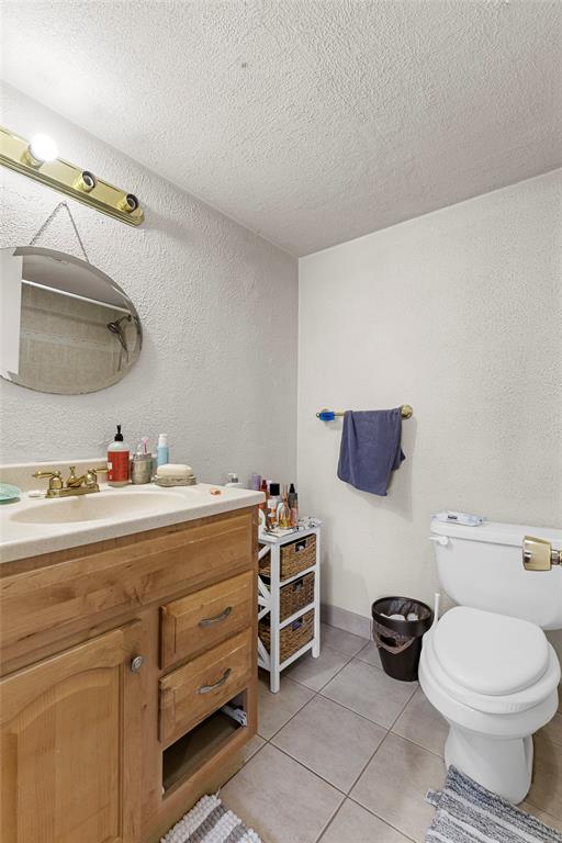 7556 Stirling Road, Unit 222 Hollywood, FL 33024 - Photo 11 of 48 a bathroom with a toilet sink and mirror