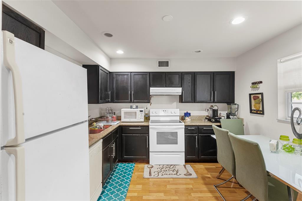 7556 Stirling Road, Unit 222 Hollywood, FL 33024 - Photo 12 of 48 a kitchen with a sink a stove and refrigerator