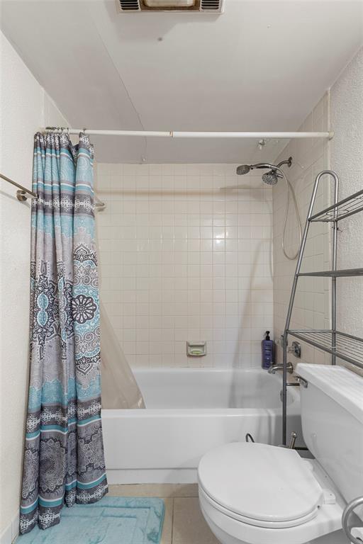 7556 Stirling Road, Unit 222 Hollywood, FL 33024 - Photo 14 of 48 a bathroom with a toilet and a shower