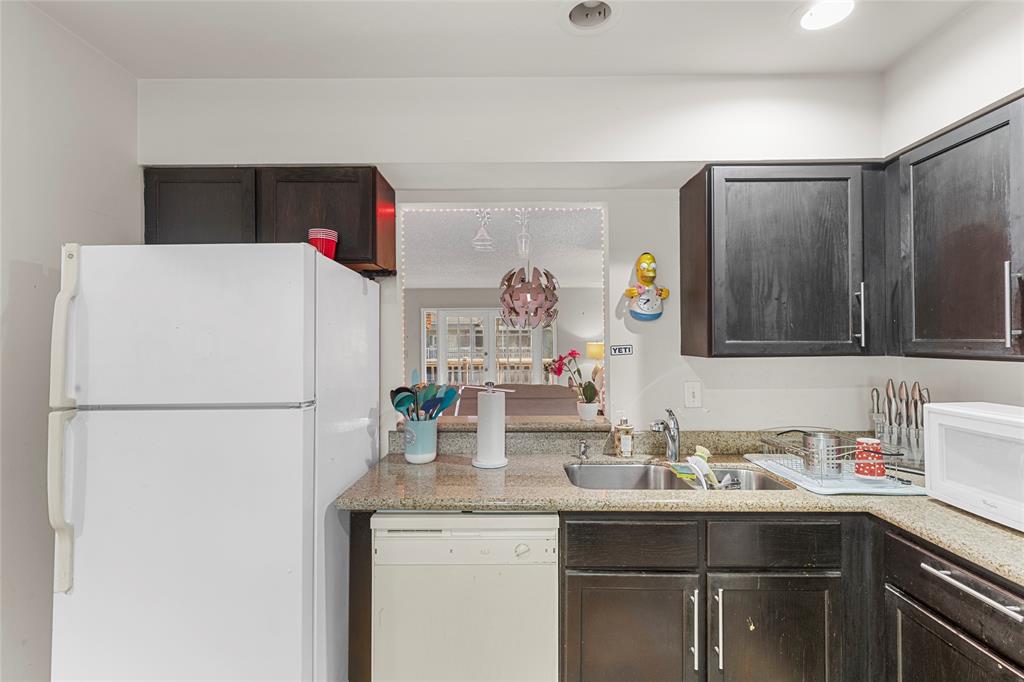7556 Stirling Road, Unit 222 Hollywood, FL 33024 - Photo 16 of 48 a bathroom with a sink and a refrigerator