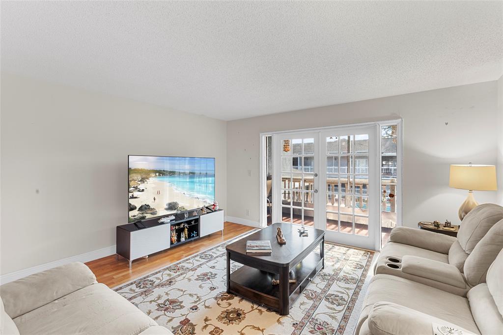 7556 Stirling Road, Unit 222 Hollywood, FL 33024 - Photo 18 of 48 a living room with furniture and a large window